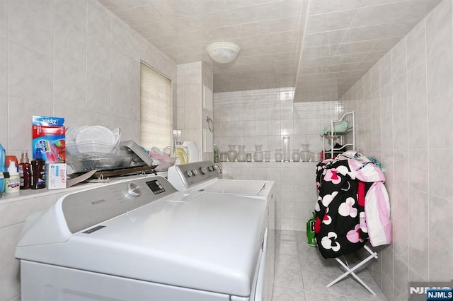 39-23 Pershing St, Fair Lawn, NJ 07410 - laundry room with tile walls, independent washer and dryer, and tile patterned flooring