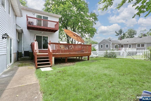 39-23 Pershing St, Fair Lawn, NJ 07410 - fenced backyard featuring a wooden deck and a balcony