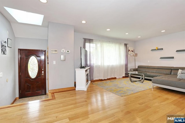 39-23 Pershing St, Fair Lawn, NJ 07410 - entryway featuring light wood-type flooring, a skylight, and recessed lighting