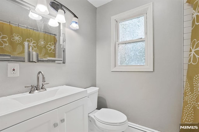 2 Ann St, Bloomingdale, NJ 07403 - bathroom featuring vanity, curtained shower, and baseboard heating