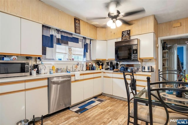 116 Berkeley Ave, Bloomfield, NJ 07003 - kitchen featuring stainless steel appliances, ceiling fan, light countertops, light wood-type flooring, and white cabinetry