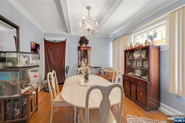 116 Berkeley Ave, Bloomfield, NJ 07003 - dining space with light wood-style flooring, a chandelier, beam ceiling, and ornamental molding
