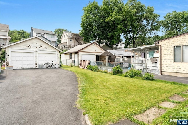 116 Berkeley Ave, Bloomfield, NJ 07003 - view of front of property featuring a garage, a residential view, and an outdoor structure