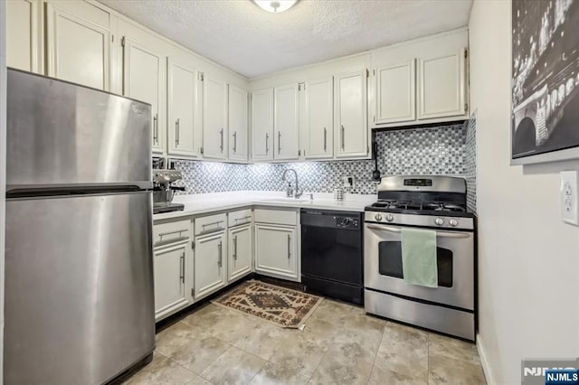 555 N Ave Unit 23C, Fort Lee, NJ 07024 - kitchen featuring stainless steel appliances, light countertops, decorative backsplash, a textured ceiling, and white cabinets
