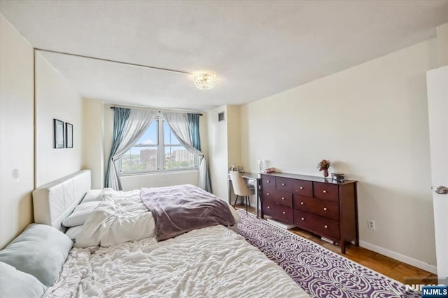 555 N Ave Unit 23C, Fort Lee, NJ 07024 - bedroom featuring baseboards and wood finished floors