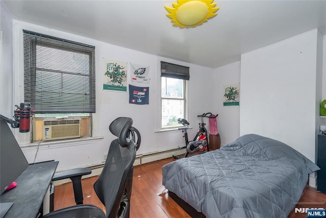 23 Preston St, Ridgefield Park, NJ 07660 - bedroom with a baseboard heating unit, wood finished floors, cooling unit, and a desk