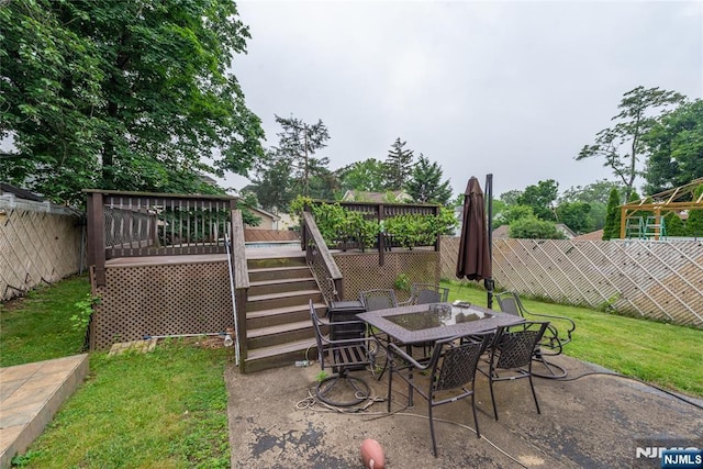 23 Preston St, Ridgefield Park, NJ 07660 - fenced backyard with stairs, a deck, outdoor dining space, and a patio area