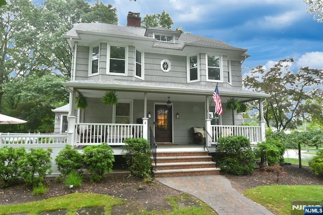 4 4th St, Park Ridge, NJ 07656 - view of front of property with a chimney, covered porch, and a shingled roof