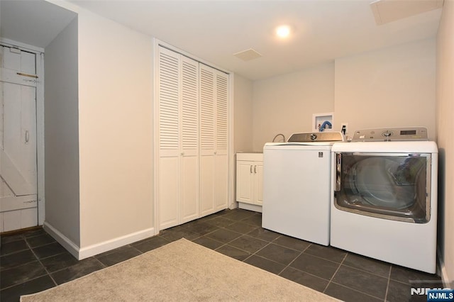 4 4th St, Park Ridge, NJ 07656 - washroom with cabinet space, washer and clothes dryer, and dark tile patterned flooring