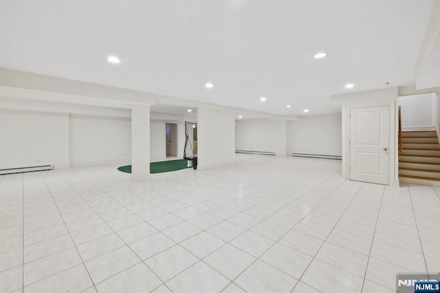 71 Roberts Rd, Englewood Cliffs, NJ 07632 - finished below grade area featuring stairway, a baseboard radiator, baseboard heating, recessed lighting, and light tile patterned floors