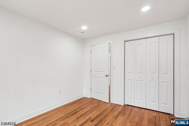 5 Midland, Glen Ridge, NJ 07028 - unfurnished bedroom with recessed lighting, light wood-type flooring, and a closet