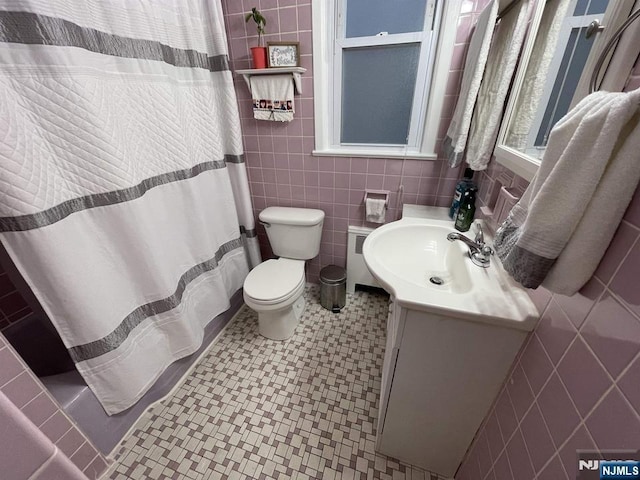 121 W 14th, Bayonne, NJ 07002 - bathroom featuring tile walls, vanity, curtained shower, and radiator