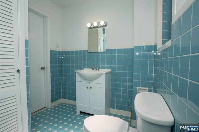 121 W 14th, Bayonne, NJ 07002 - bathroom with vanity, wainscoting, and tile walls