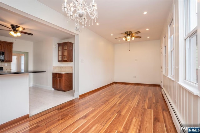121 W 14th, Bayonne, NJ 07002 - unfurnished room with a baseboard radiator, ceiling fan, healthy amount of natural light, recessed lighting, and light wood-style flooring
