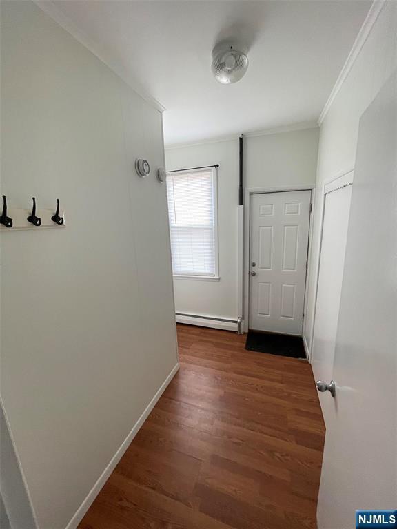121 W 14th, Bayonne, NJ 07002 - hall with ornamental molding, wood finished floors, and baseboard heating