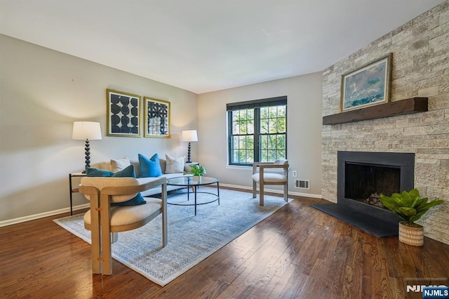 181 Long Hill Rd Unit H3, Little Falls, NJ 07424 - living room with wood finished floors and a stone fireplace