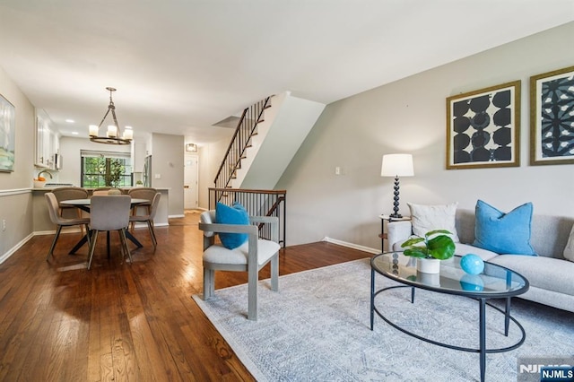 181 Long Hill Rd Unit H3, Little Falls, NJ 07424 - living room featuring dark wood-type flooring, stairway, and a chandelier