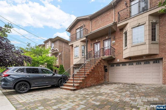 413 Washington Ave Unit C0413, Cliffside Park, NJ 07010 - view of building exterior with a garage and decorative driveway