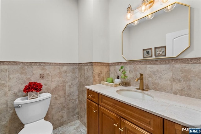 413 Washington Ave Unit C0413, Cliffside Park, NJ 07010 - bathroom featuring vanity, wainscoting, and tile walls