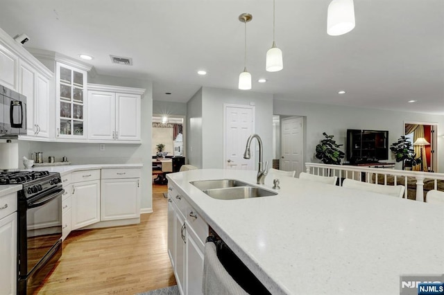 11 Katharina Pl, Twp Of Washington, NJ 07676 - kitchen featuring gas stove, light countertops, stainless steel microwave, light wood-style flooring, and recessed lighting