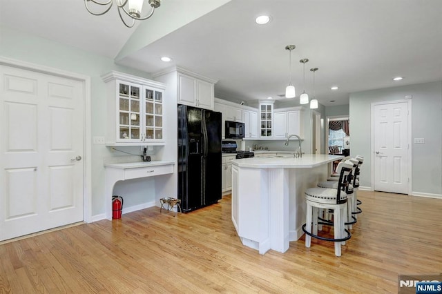 11 Katharina Pl, Twp Of Washington, NJ 07676 - kitchen with black appliances, white cabinets, light wood finished floors, glass insert cabinets, and recessed lighting