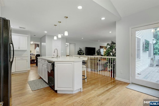 11 Katharina Pl, Twp Of Washington, NJ 07676 - kitchen with black appliances, light wood finished floors, white cabinetry, a breakfast bar area, and recessed lighting