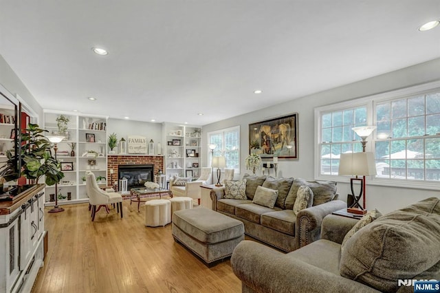 11 Katharina Pl, Twp Of Washington, NJ 07676 - living room featuring a brick fireplace, light wood-style flooring, recessed lighting, and built in features