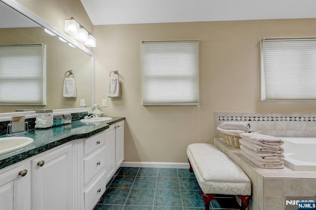 11 Katharina Pl, Twp Of Washington, NJ 07676 - bathroom featuring double vanity, a garden tub, and tile patterned floors