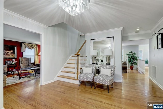 11 Katharina Pl, Twp Of Washington, NJ 07676 - entrance foyer featuring stairs, wood finished floors, crown molding, and a chandelier