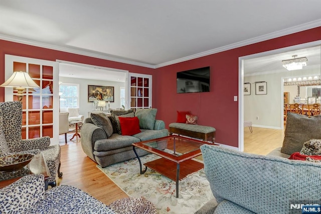 11 Katharina Pl, Twp Of Washington, NJ 07676 - living room with wood finished floors, ornamental molding, and a chandelier