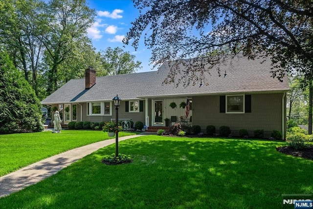 63 Kathleen Ct, Wayne, NJ 07470 - view of front of home with a chimney, a front lawn, and roof with shingles