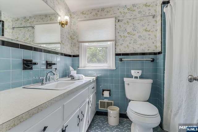 63 Kathleen Ct, Wayne, NJ 07470 - bathroom with vanity, wallpapered walls, tile walls, a wainscoted wall, and a shower with shower curtain