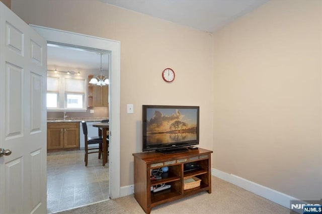 30 Zeliff Ave, Little Falls, NJ 07424 - living area featuring a chandelier and baseboards