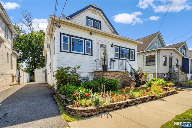 30 Zeliff Ave, Little Falls, NJ 07424 - view of front facade with a garage
