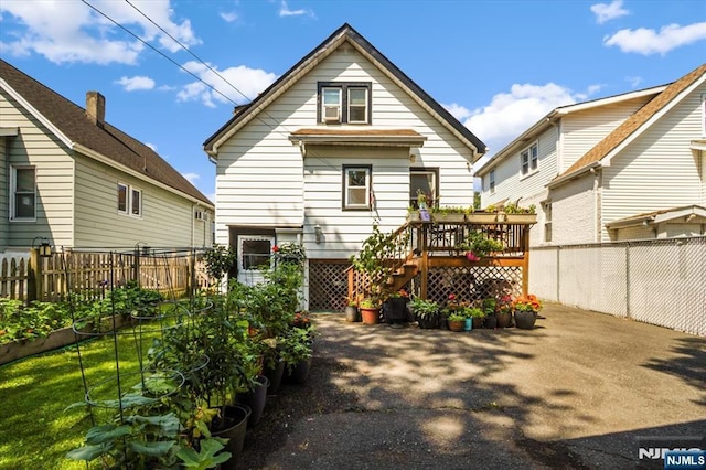 30 Zeliff Ave, Little Falls, NJ 07424 - back of property featuring a wooden deck, a fenced backyard, and stairs