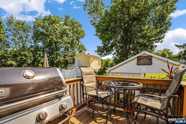 30 Zeliff Ave, Little Falls, NJ 07424 - wooden terrace with a grill