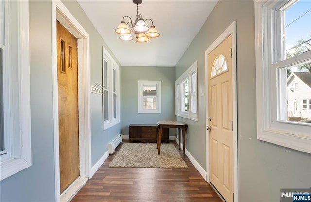 30 Zeliff Ave, Little Falls, NJ 07424 - entrance foyer with healthy amount of natural light, dark wood-style floors, a chandelier, and a baseboard heating unit