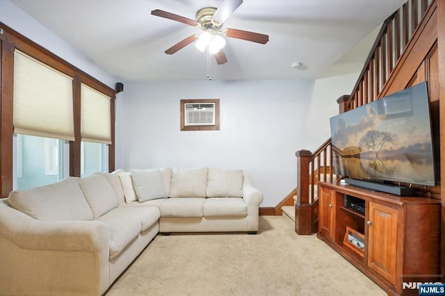 30 Zeliff Ave, Little Falls, NJ 07424 - living room featuring a wall mounted air conditioner, a ceiling fan, stairway, and light carpet