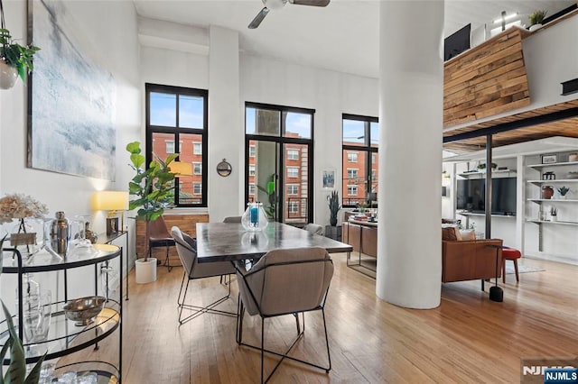 205 10th St Unit 307, Jersey City, NJ 07302 - dining area with hardwood / wood-style flooring, healthy amount of natural light, and a ceiling fan