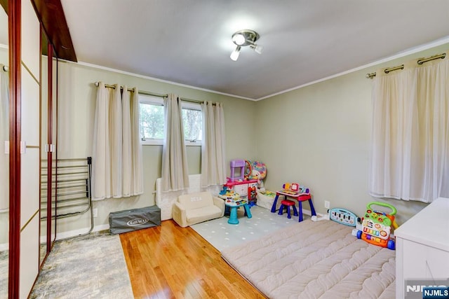 139 Donato Dr, Little Falls, NJ 07424 - recreation room with crown molding and wood finished floors