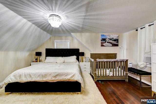 139 Donato Dr, Little Falls, NJ 07424 - bedroom featuring hardwood / wood-style floors, a chandelier, and lofted ceiling