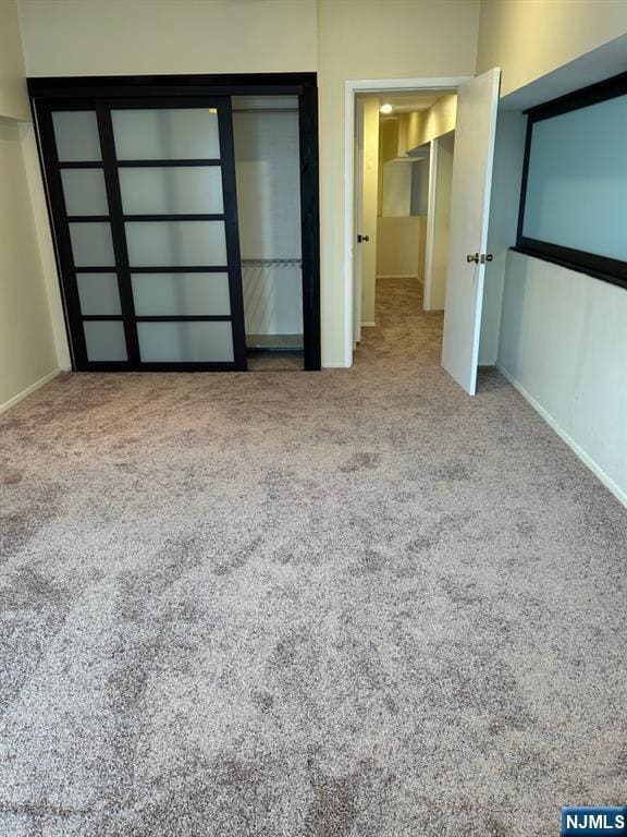 111 Mulberry St Unit 1418, Newark, NJ 07102 - unfurnished bedroom featuring carpet flooring and a closet