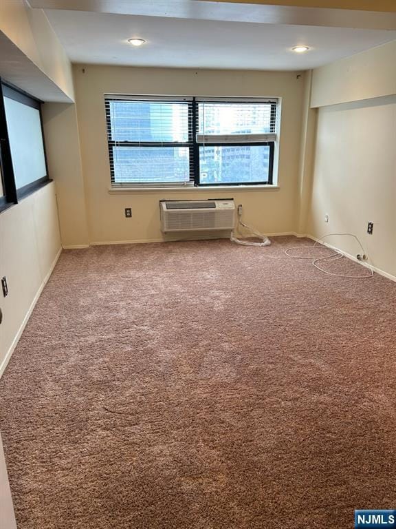 111 Mulberry St Unit 1418, Newark, NJ 07102 - empty room with an AC wall unit, plenty of natural light, and carpet flooring