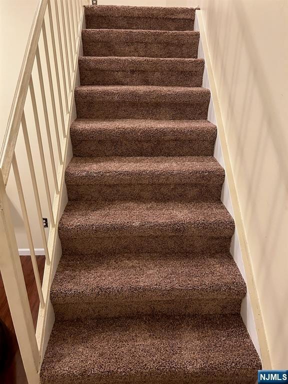 111 Mulberry St Unit 1418, Newark, NJ 07102 - stairway featuring carpet