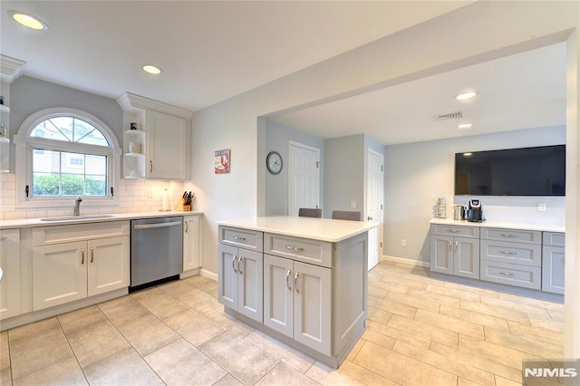 306 Boulevard, Pequannock Township, NJ 07444 - kitchen featuring stainless steel dishwasher, decorative backsplash, light countertops, gray cabinets, and open shelves