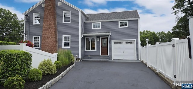 306 Boulevard, Pequannock Township, NJ 07444 - traditional-style house featuring asphalt driveway, an attached garage, and a shingled roof