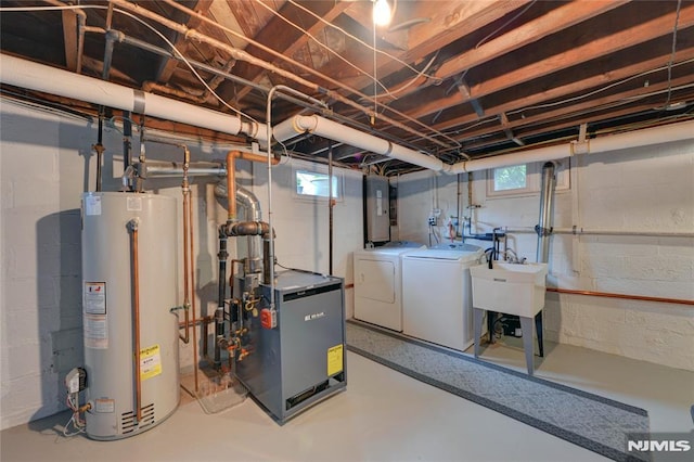 306 Boulevard, Pequannock Township, NJ 07444 - basement with gas water heater, washing machine and dryer, a heating unit, and healthy amount of natural light