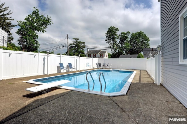 306 Boulevard, Pequannock Township, NJ 07444 - view of swimming pool featuring a patio, a fenced backyard, and a diving board