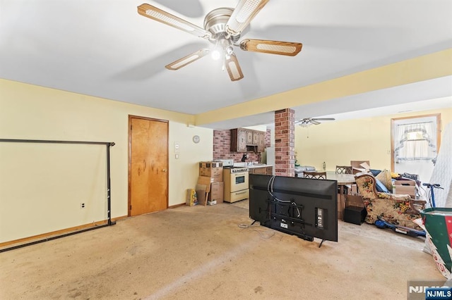 132 17th St, Prospect Park, NJ 07508 - living area featuring ceiling fan, decorative columns, and light colored carpet