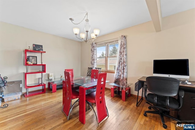 132 17th St, Prospect Park, NJ 07508 - dining area featuring a chandelier and wood-type flooring